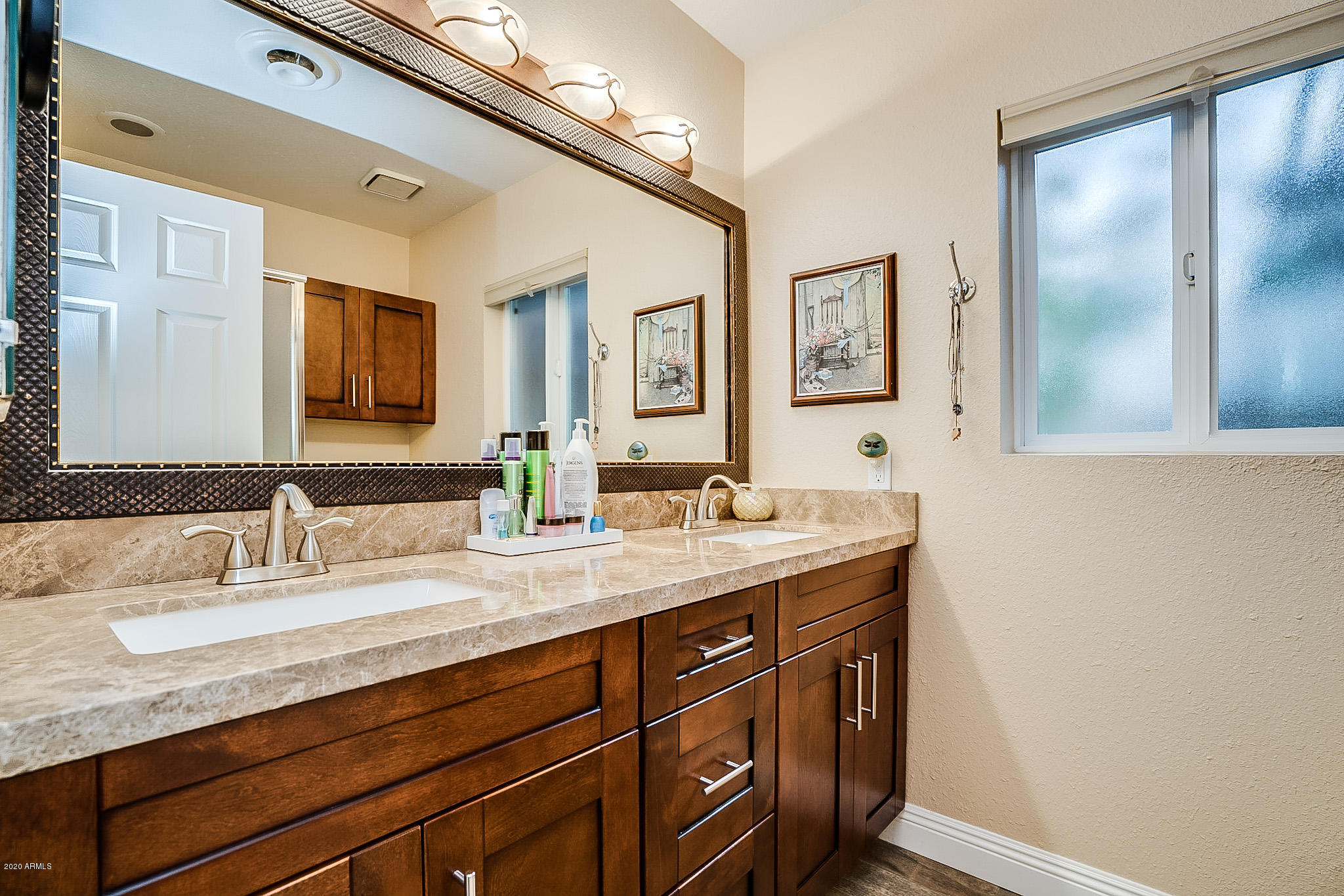 5630 South Outrigger Road Tempe, AZ 85283 - Photo 24 of 38 a bathroom with a granite countertop sink mirror and double