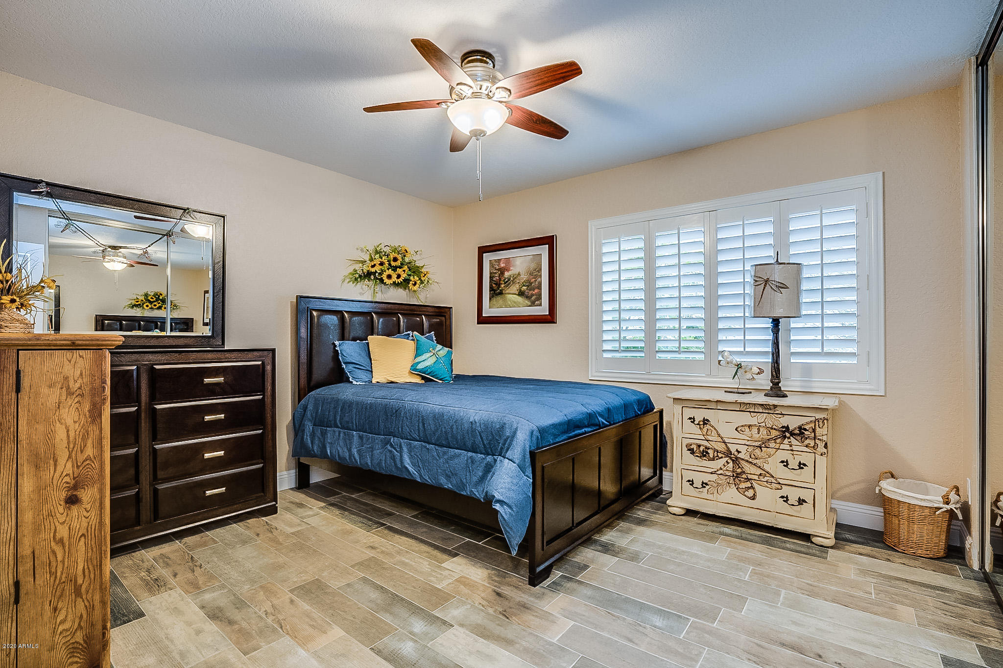 5630 South Outrigger Road Tempe, AZ 85283 - Photo 26 of 38 a bedroom with a bed and a chandelier