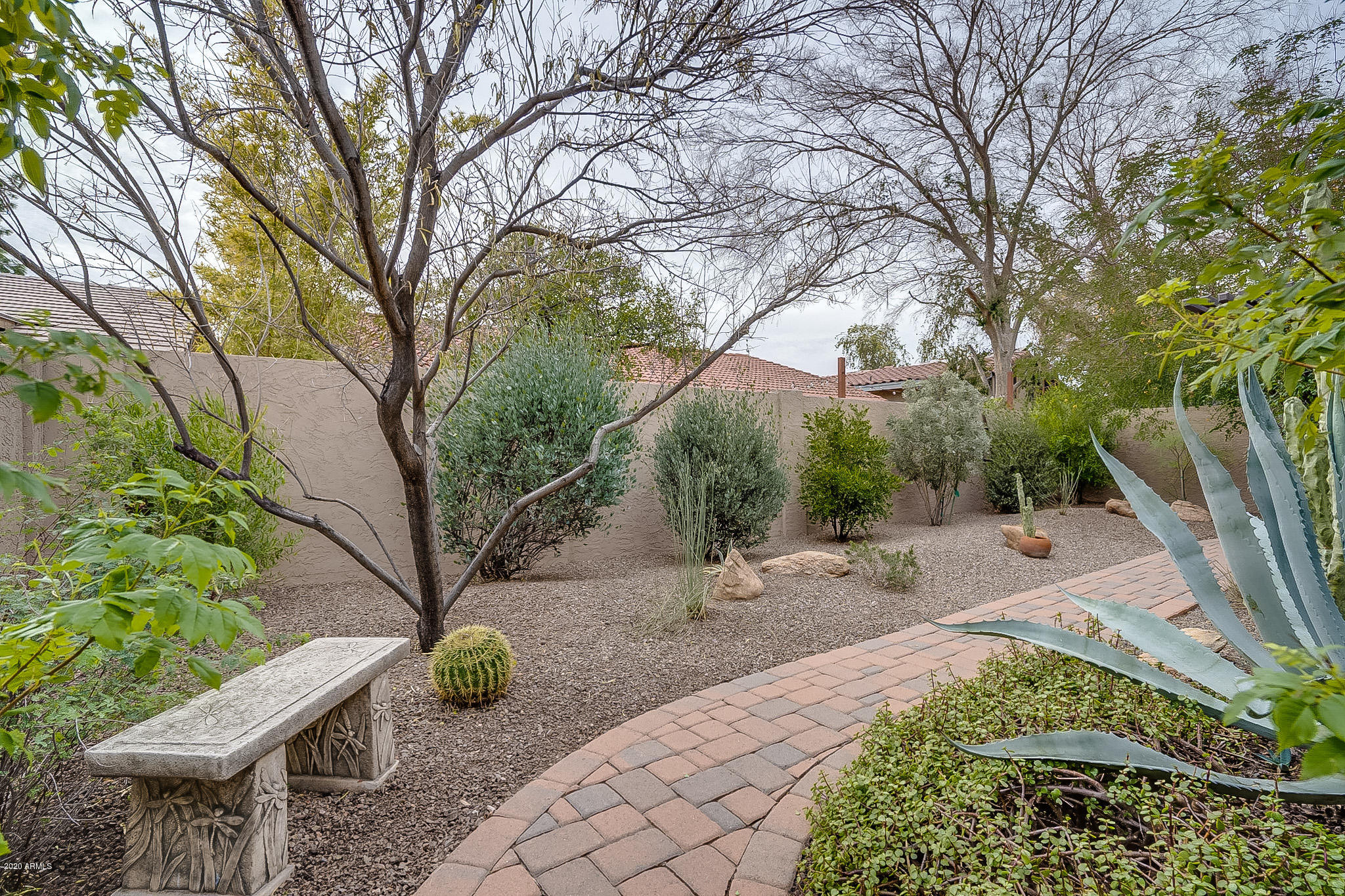 5630 South Outrigger Road Tempe, AZ 85283 - Photo 36 of 38 a backyard of a house with table and chairs