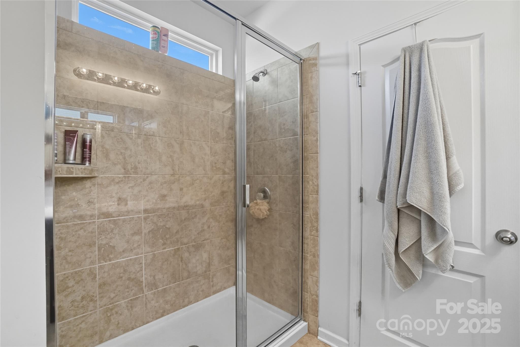 134 East Neel Ranch Road, Unit 13 Mooresville, NC 28115 - Photo 13 of 20 a bathroom with a shower and a tub