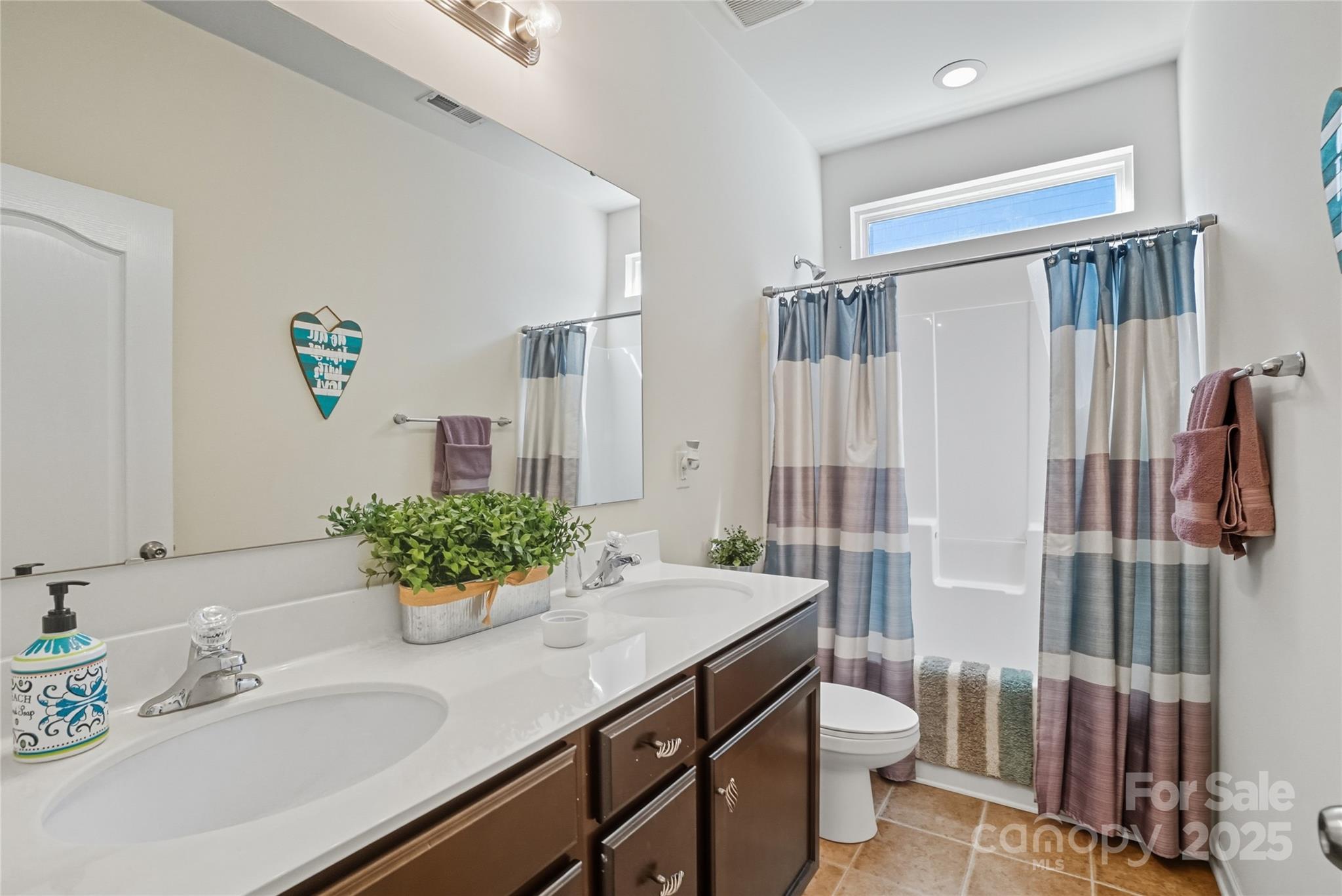 134 East Neel Ranch Road, Unit 13 Mooresville, NC 28115 - Photo 17 of 20 a bathroom with a granite countertop sink and a mirror