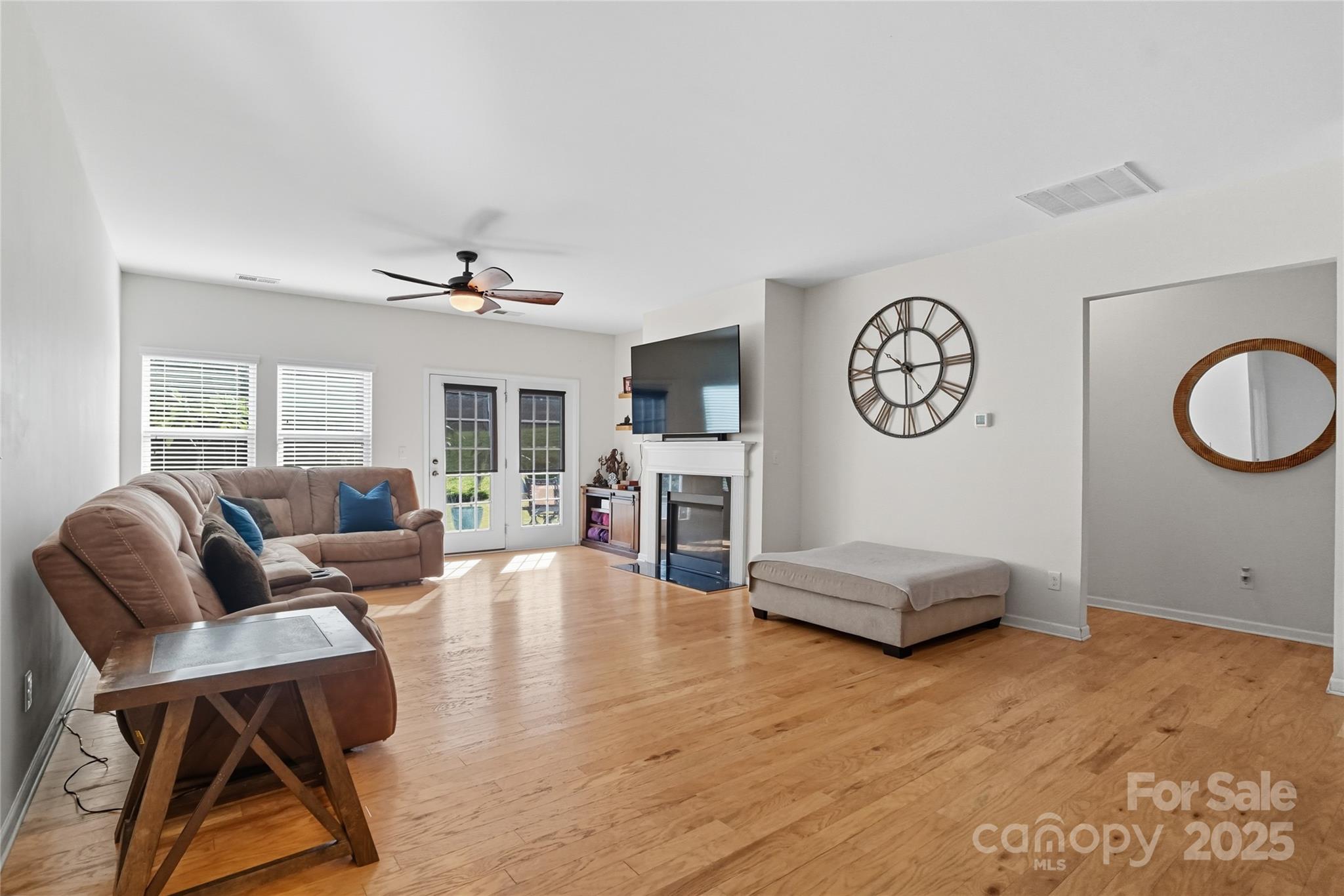 134 East Neel Ranch Road, Unit 13 Mooresville, NC 28115 - Photo 5 of 20 a living room with furniture and wooden floor