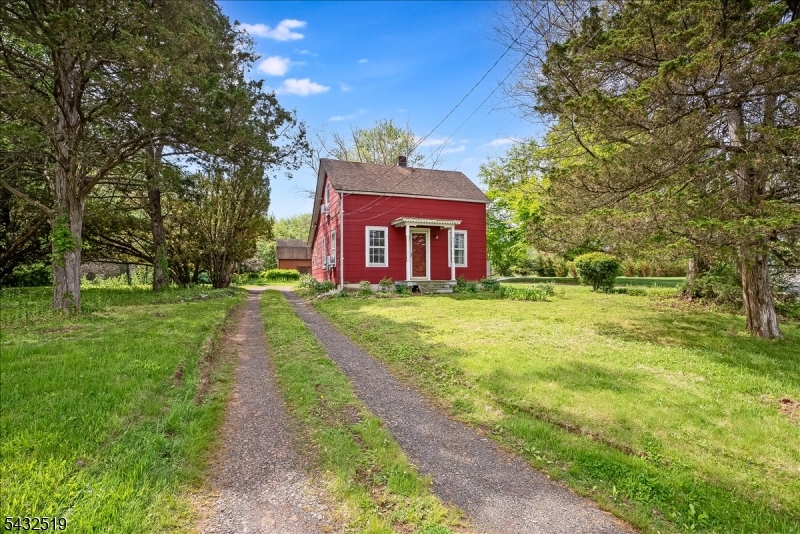 3225 Valley Road Bernards, NJ 07920 - Photo 2 of 24 a front view of a house with a yard