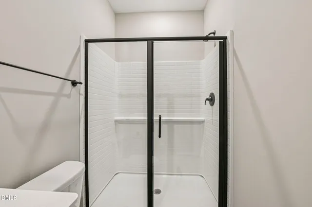 a bathroom with a sink toilet and mirror