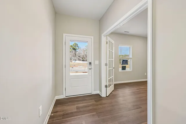 a black and white photo of a open kitchen