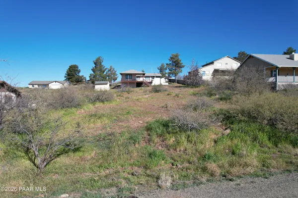 a view of a backyard of the house