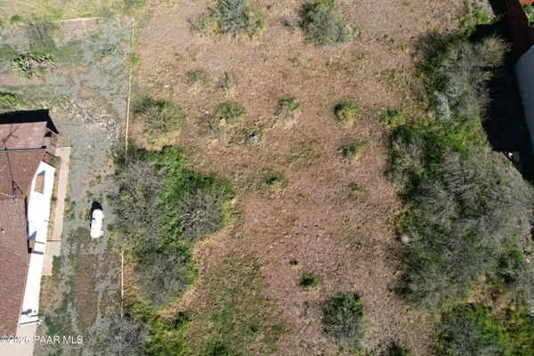 a aerial view of a house with a yard