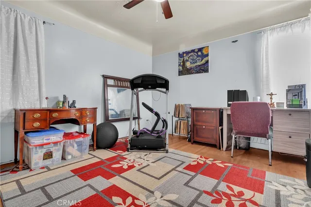 a bedroom with furniture and a baby crib