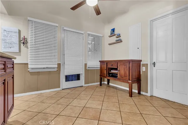a view of a livingroom with furniture and a window