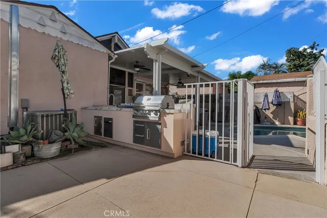 a view of a porch with furniture and floor to ceiling window