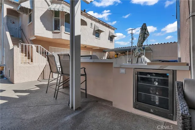 a view of a patio with table and chairs