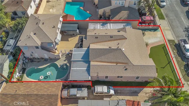 an aerial view of residential houses with outdoor space