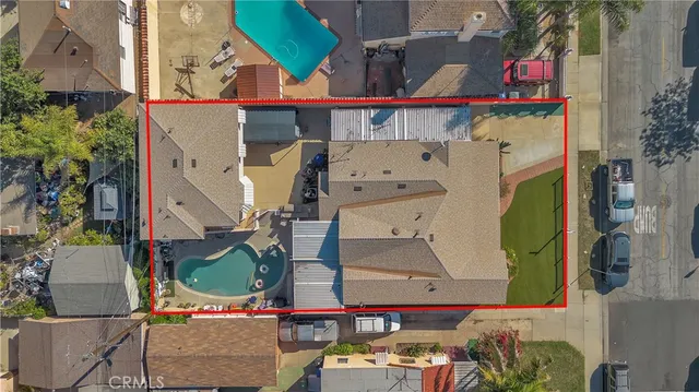 an aerial view of residential houses with outdoor space