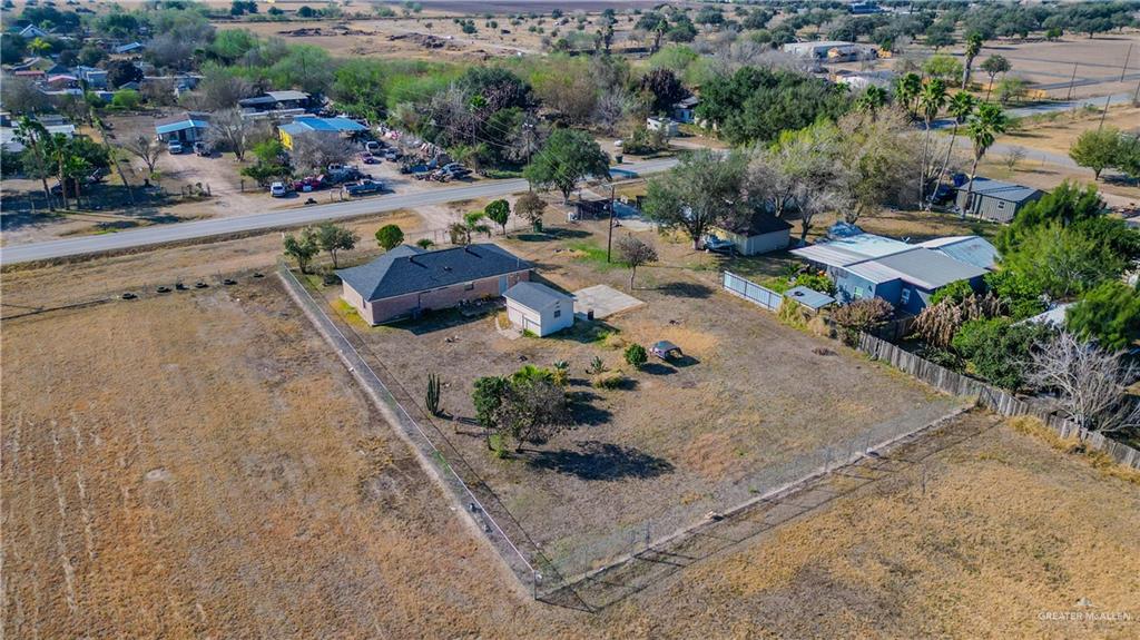 896 Earling Road Donna, TX 78537 - Photo 11 of 15 an aerial view of a house with a garden and lake view