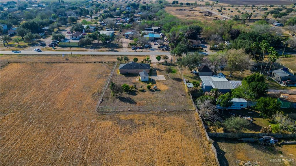 896 Earling Road Donna, TX 78537 - Photo 15 of 15 an aerial view of a house with a yard and lake view