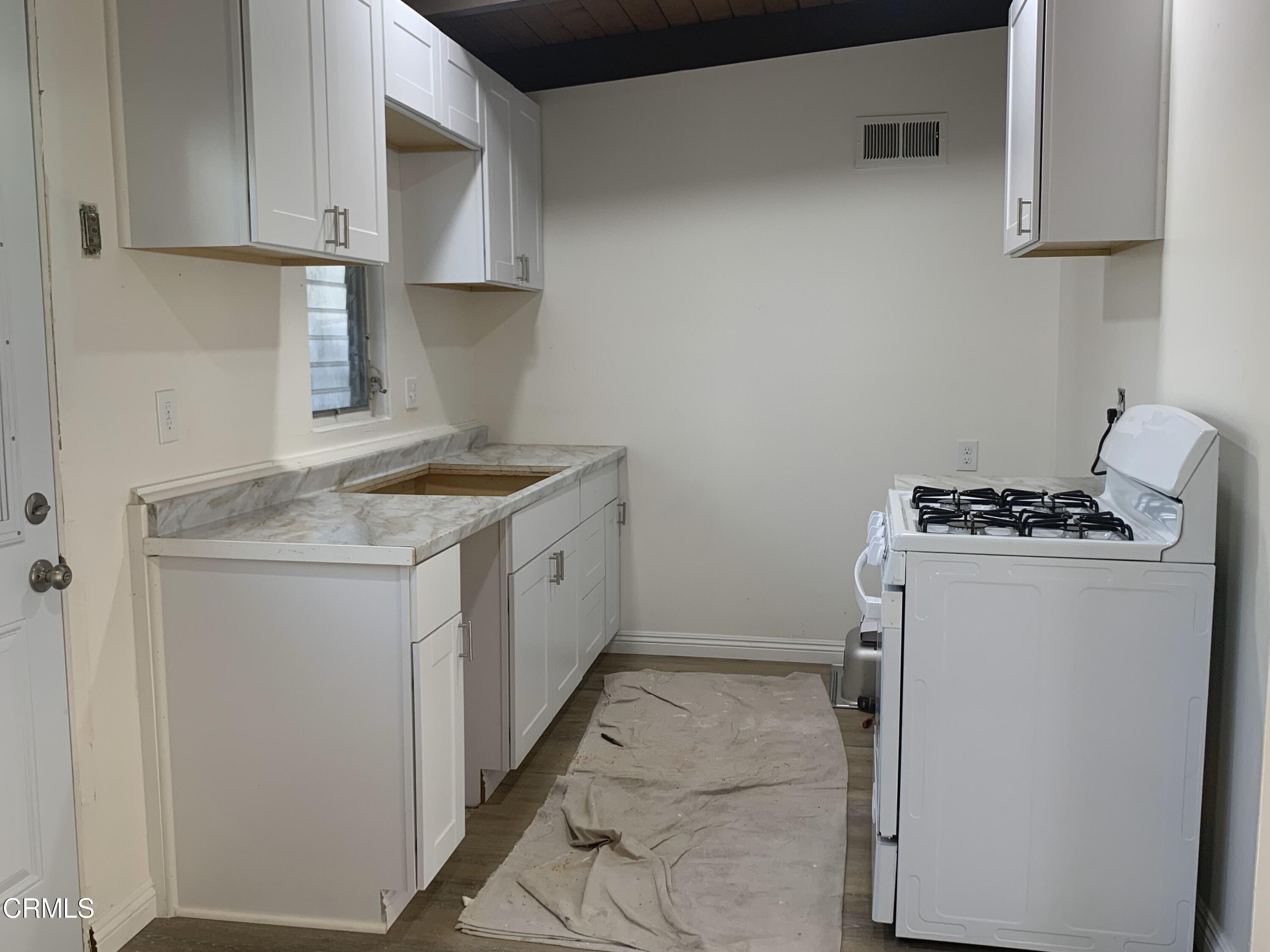 1746 Atchison Street Pasadena, CA 91104 - Photo 15 of 22 a utility room with sink dryer and washer