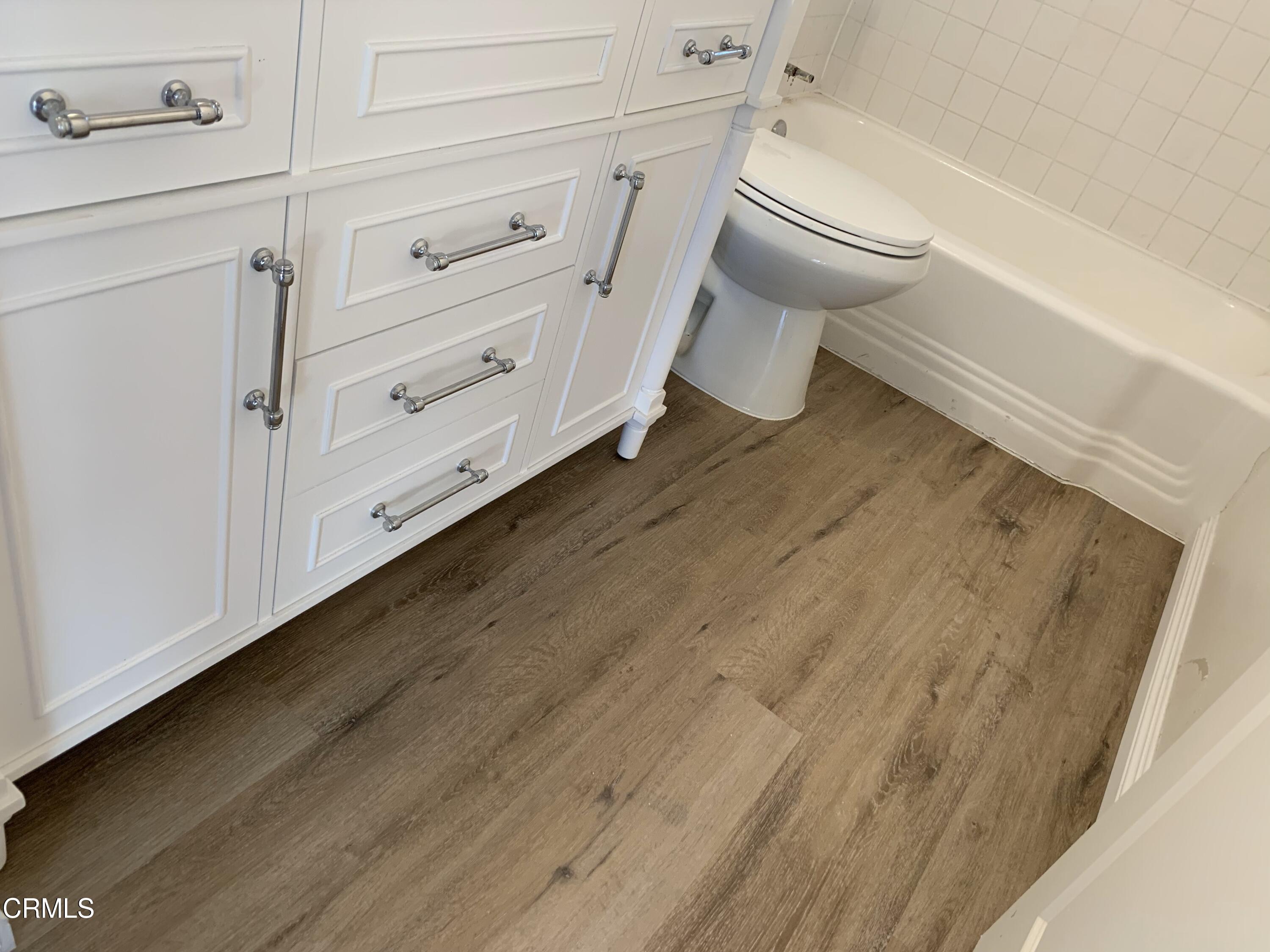 1746 Atchison Street Pasadena, CA 91104 - Photo 16 of 22 a bathroom with a toilet and a rug