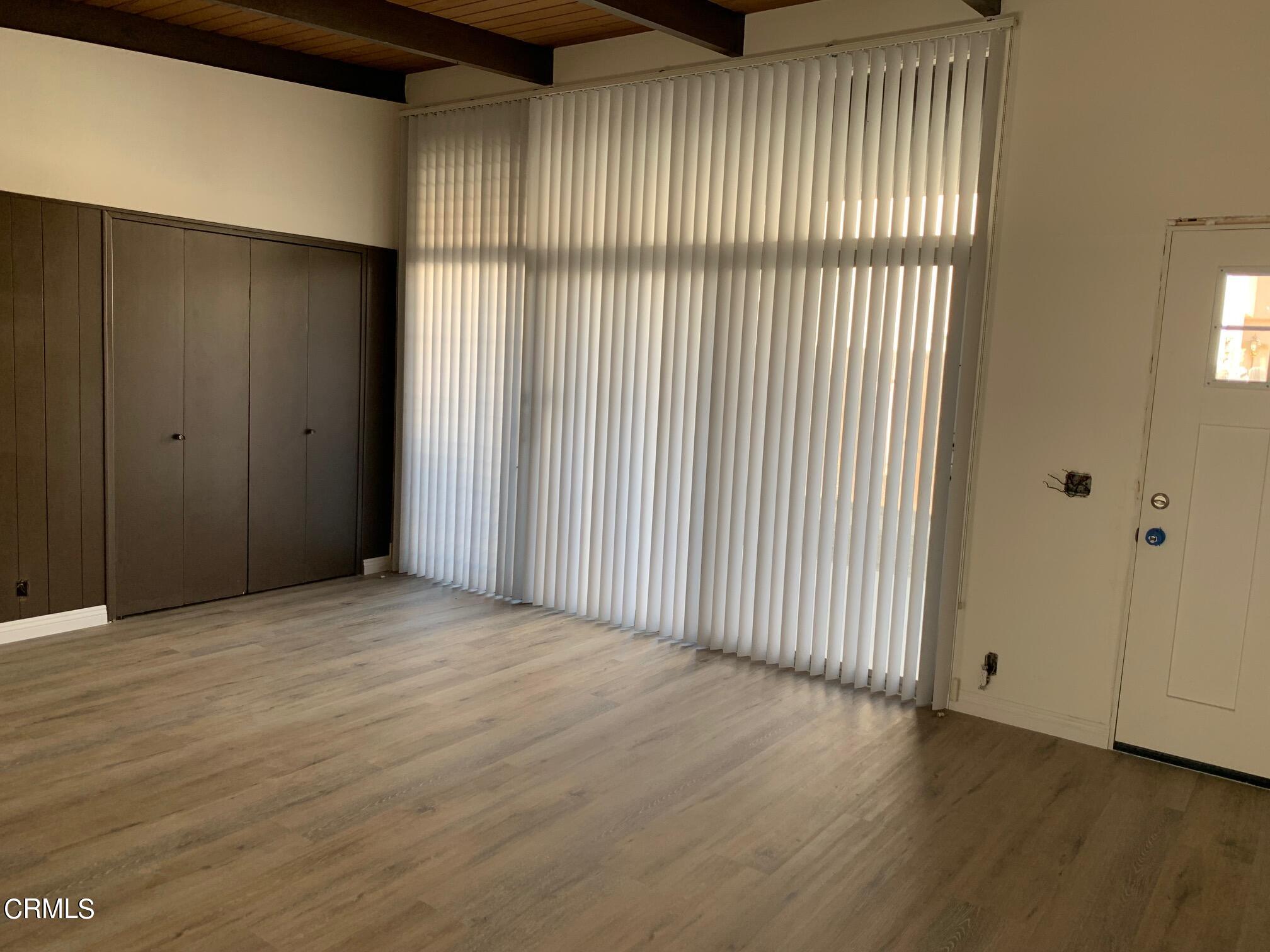 1746 Atchison Street Pasadena, CA 91104 - Photo 19 of 22 a view of an empty room with wooden floor