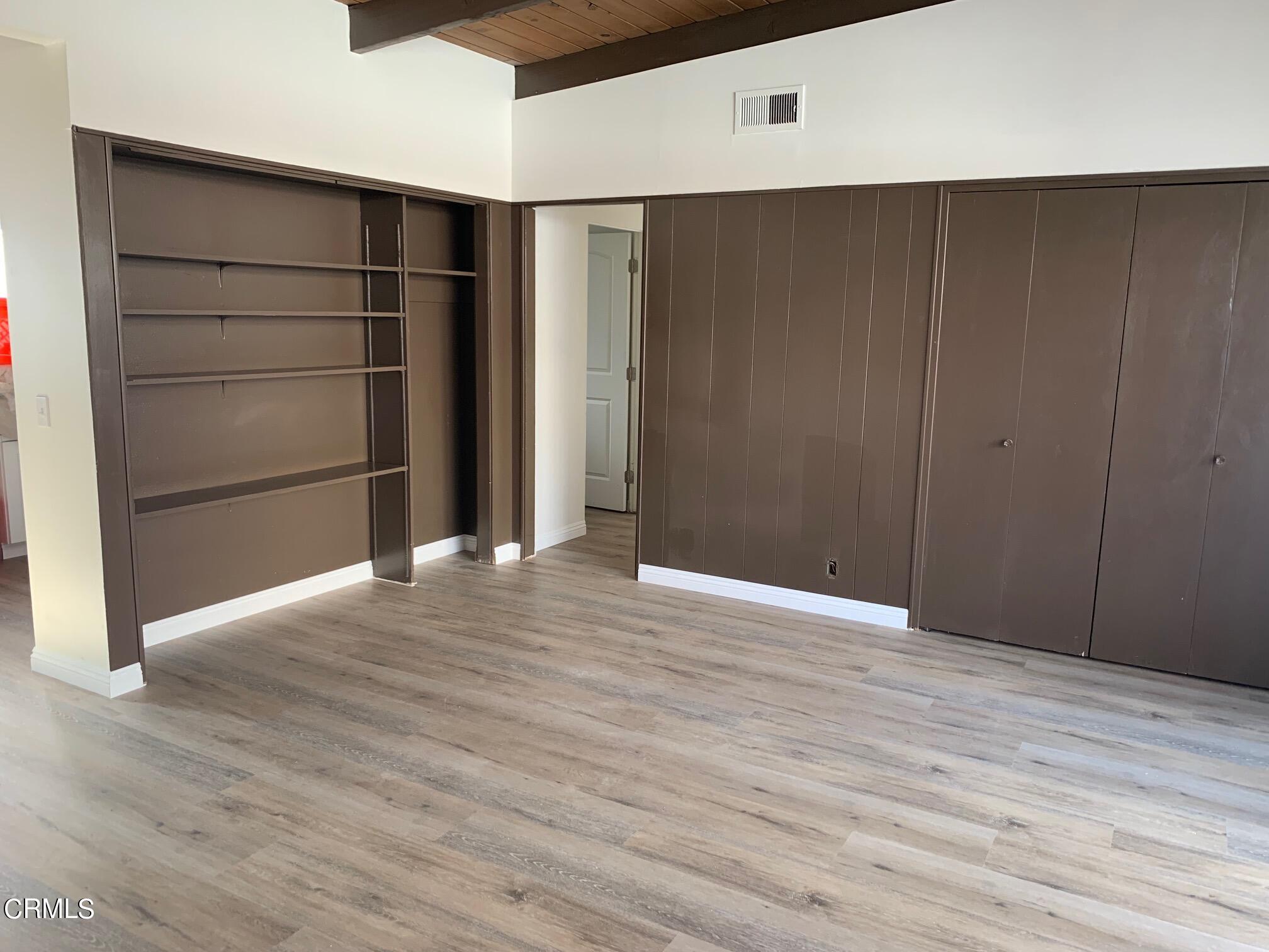 1746 Atchison Street Pasadena, CA 91104 - Photo 20 of 22 a view of an empty room with wooden floor