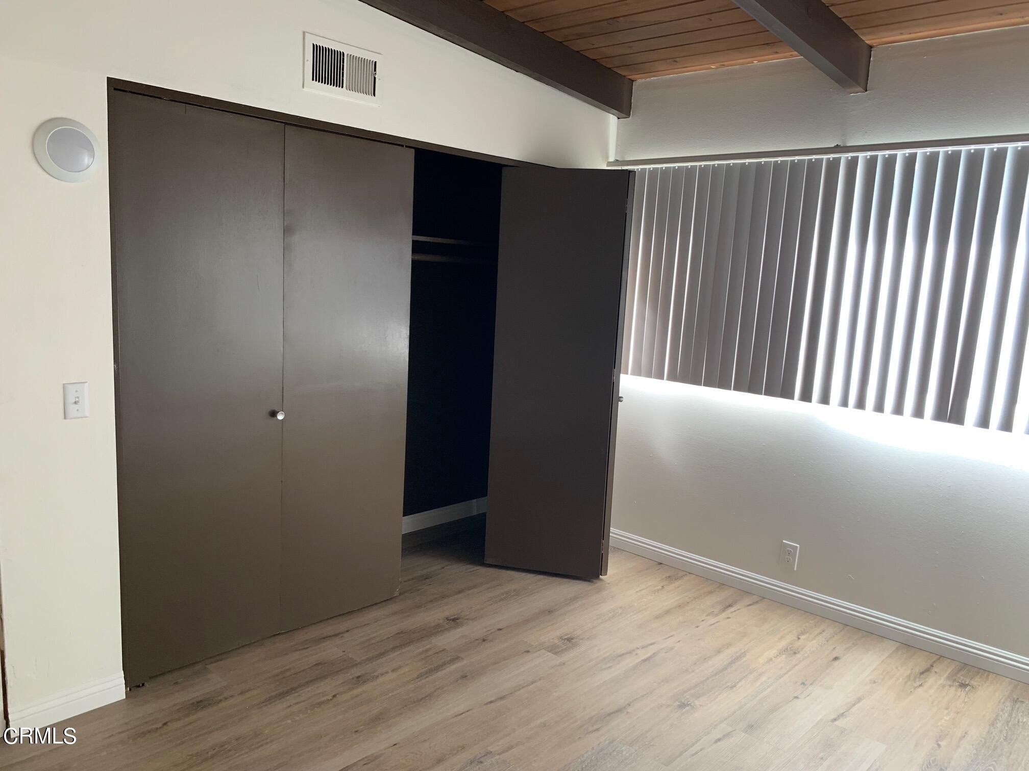 1746 Atchison Street Pasadena, CA 91104 - Photo 21 of 22 a view of an empty room with wooden floor