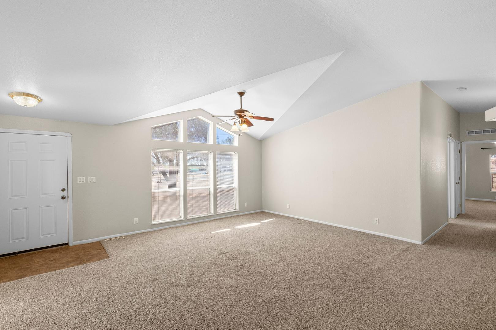 37408 North 20th Street Phoenix, AZ 85086 - Photo 15 of 28 an empty room with windows and ceiling fan