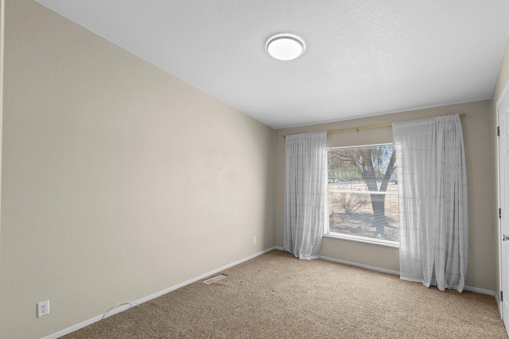 37408 North 20th Street Phoenix, AZ 85086 - Photo 18 of 28 an empty room with windows