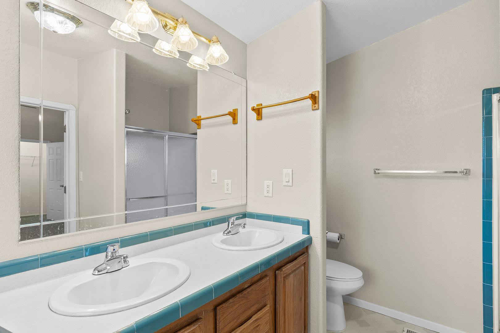 37408 North 20th Street Phoenix, AZ 85086 - Photo 24 of 28 a bathroom with a sink and a mirror