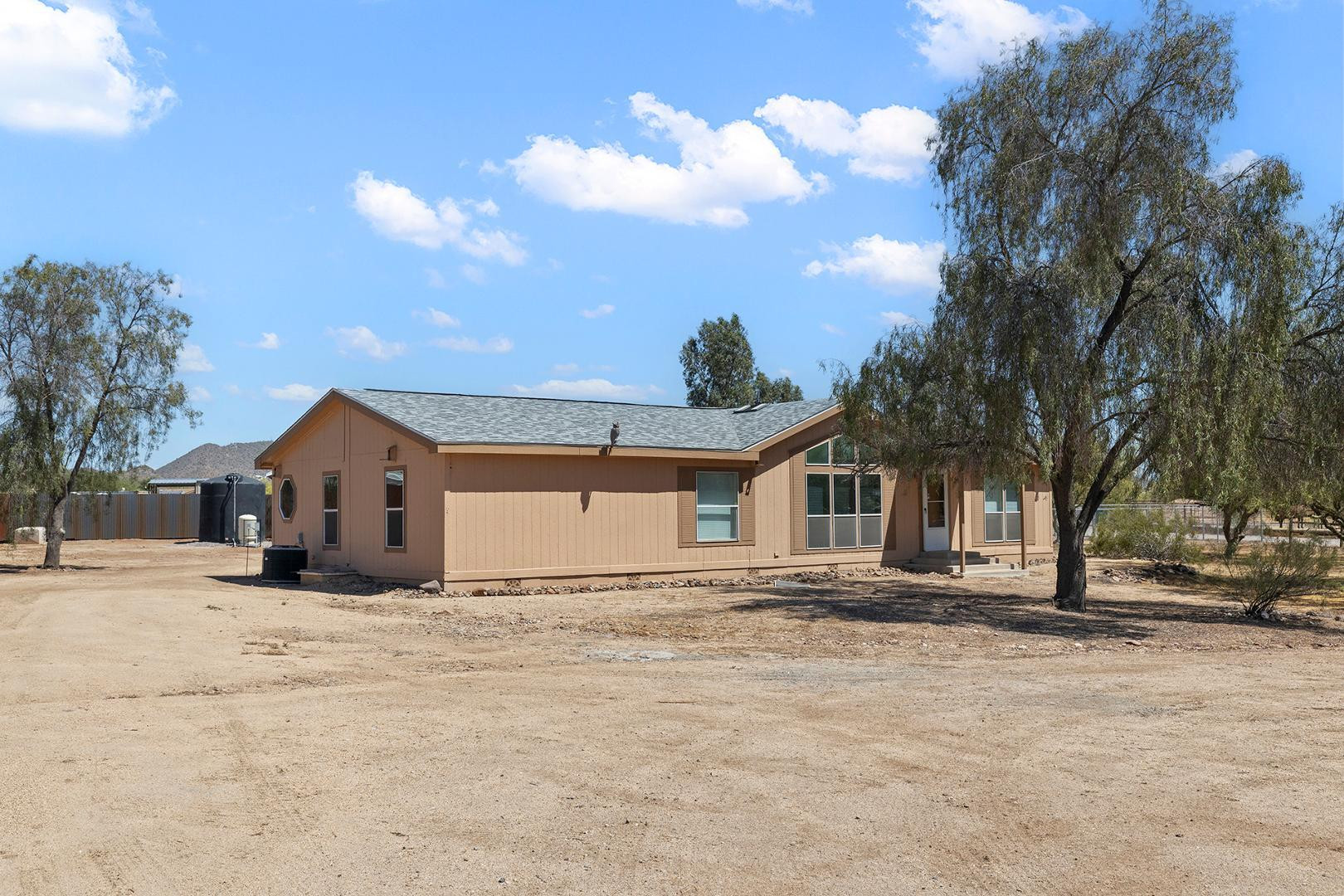 37408 North 20th Street Phoenix, AZ 85086 - Photo 4 of 28 a view of a house with a snow in the yard
