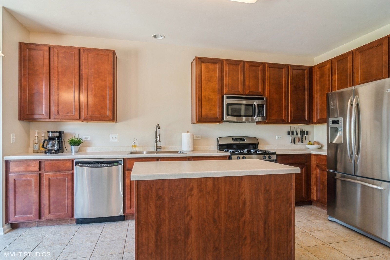 4072 Pompton Avenue Elgin, IL 60124 - Photo 3 of 13 a kitchen with stainless steel appliances granite countertop a refrigerator stove a sink and dishwasher