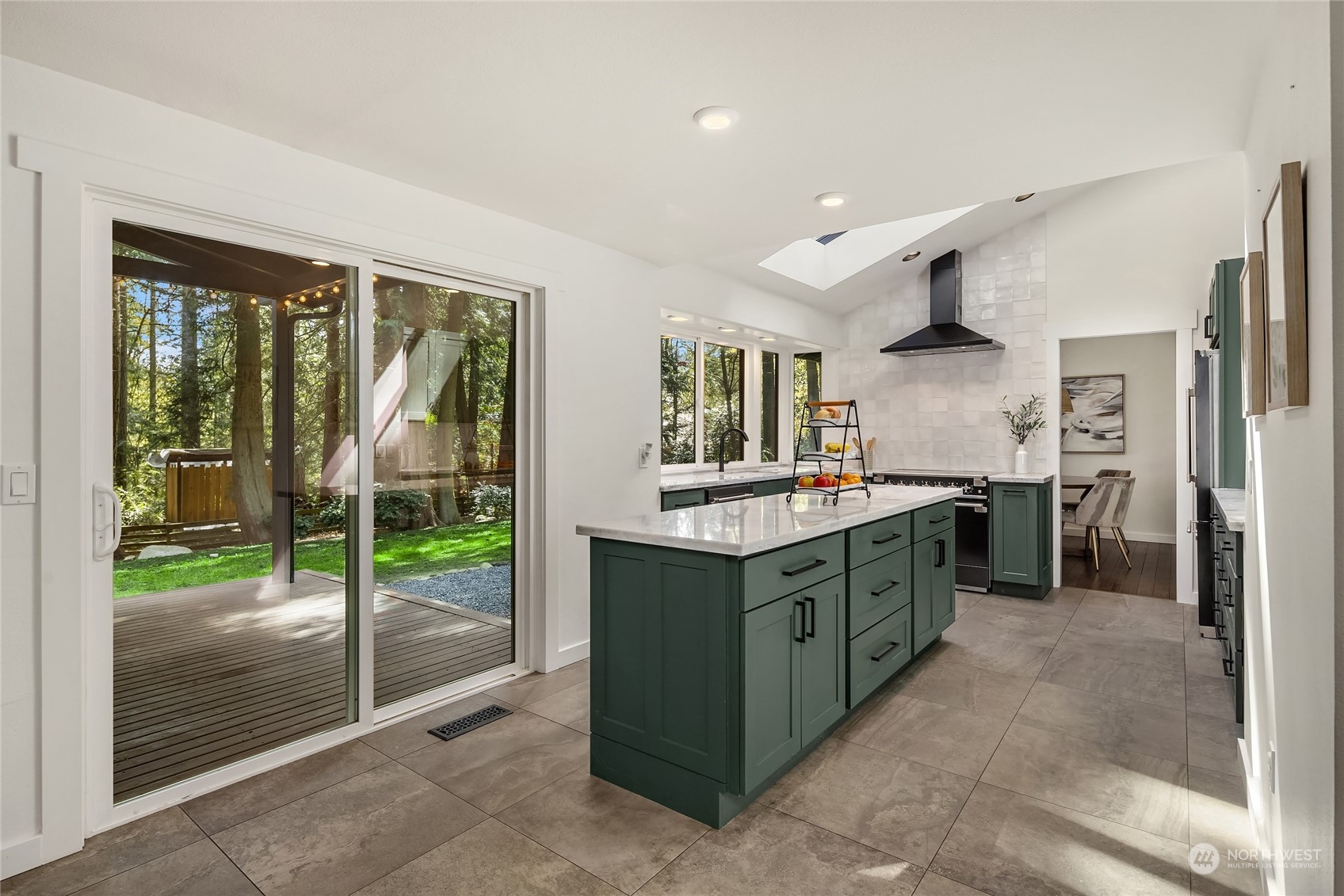 6322 Lariat Loop Bainbridge Island, WA 98110 - Photo 12 of 40 a kitchen with sink cabinets and outdoor view