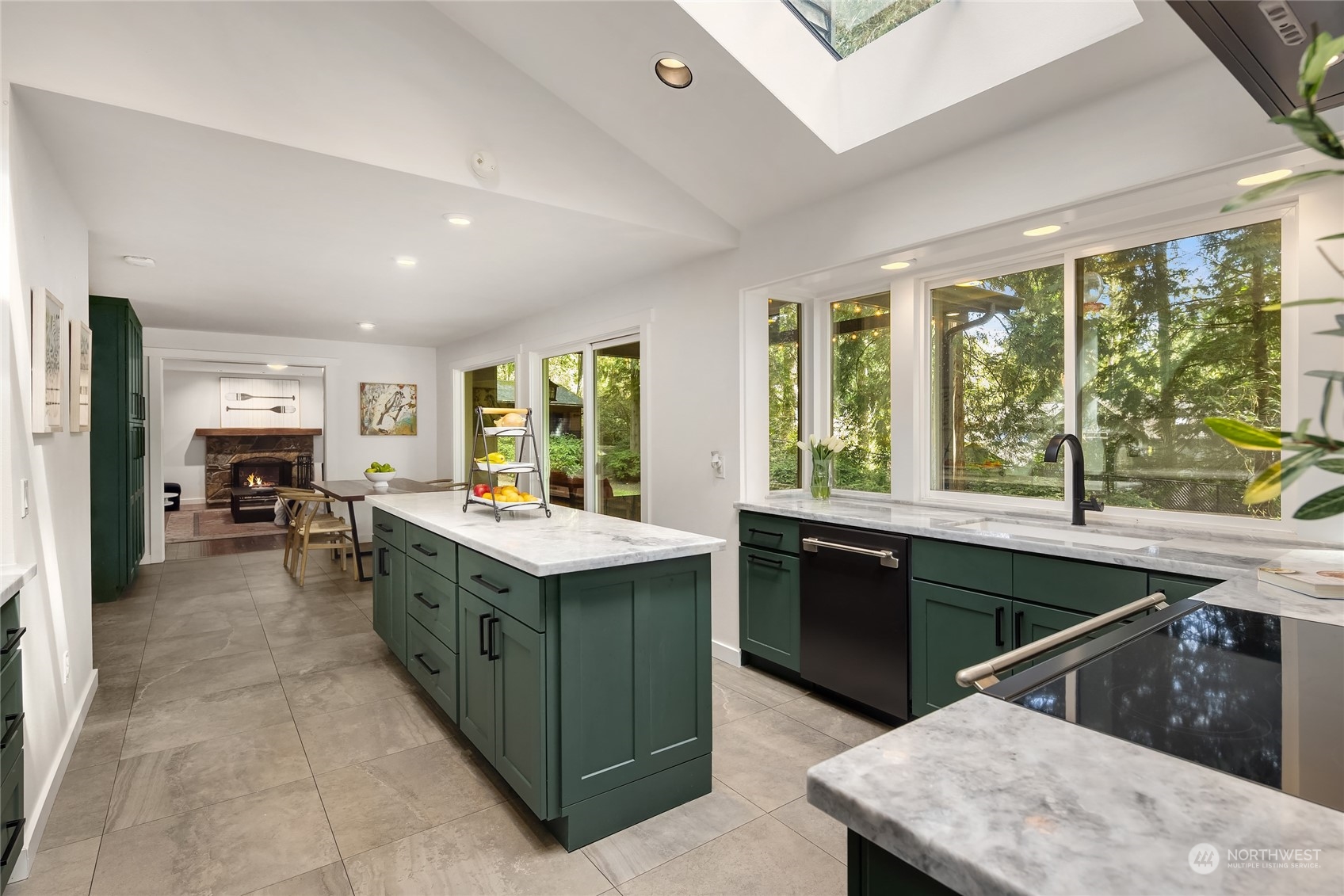 6322 Lariat Loop Bainbridge Island, WA 98110 - Photo 13 of 40 a kitchen with a stove sink and cabinets