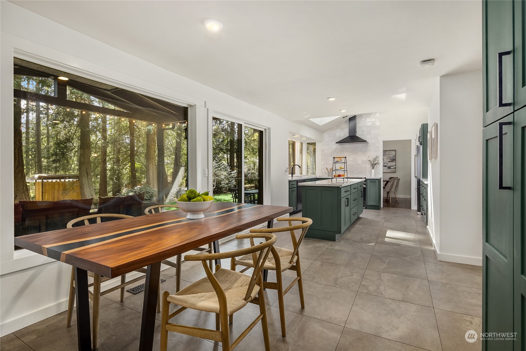 6322 Lariat Loop Bainbridge Island, WA 98110 - Photo 14 of 40 a room with a table chairs and refrigerator