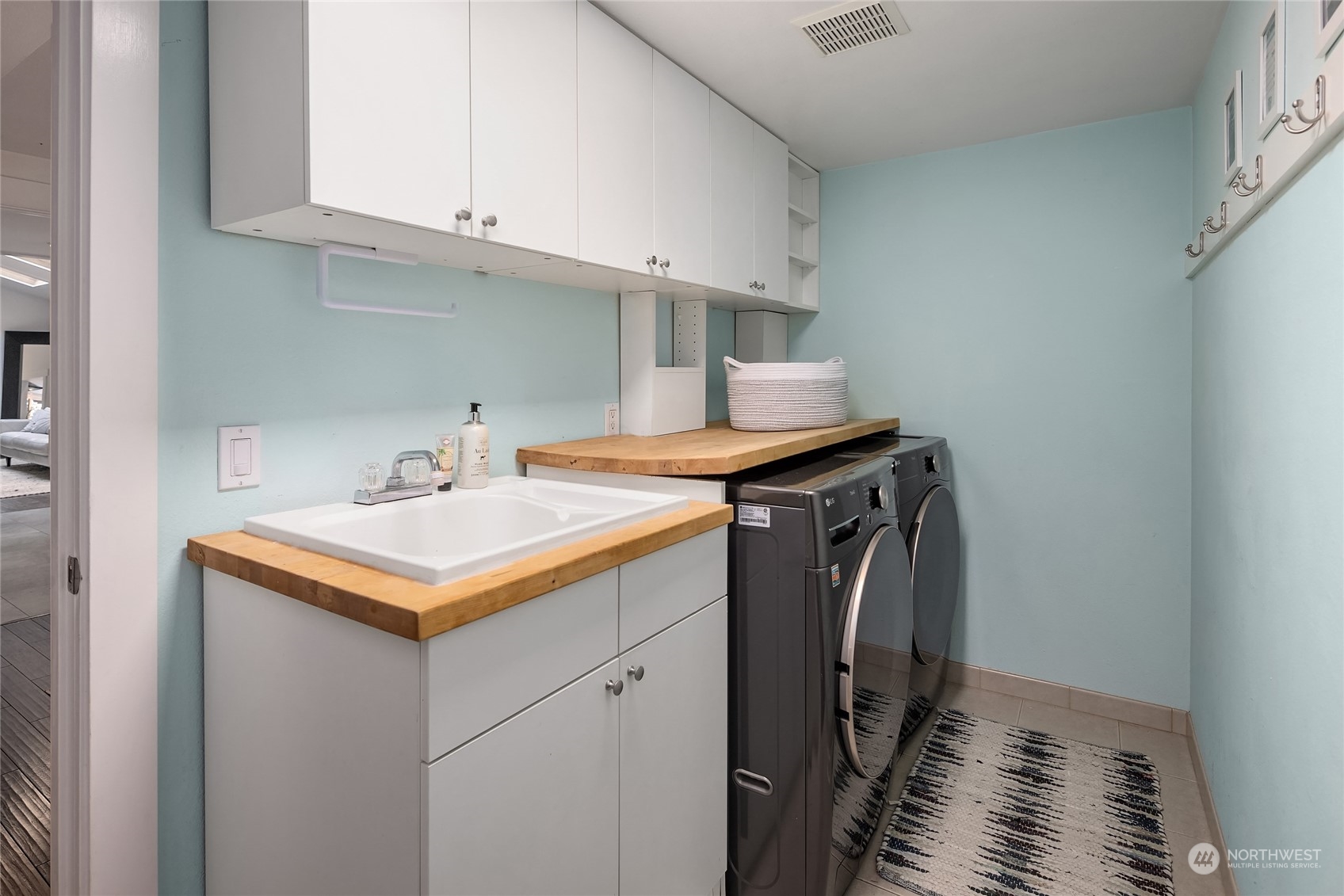 6322 Lariat Loop Bainbridge Island, WA 98110 - Photo 19 of 40 a utility room with washer and dryer
