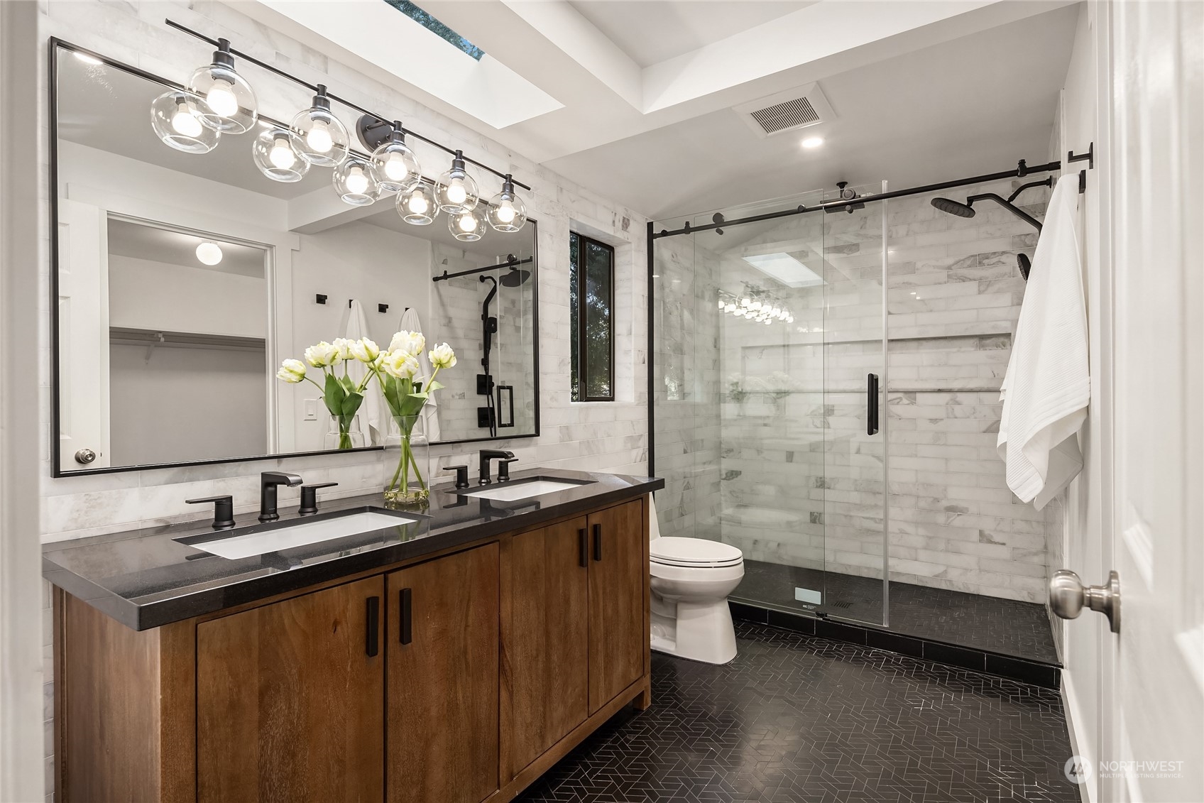 6322 Lariat Loop Bainbridge Island, WA 98110 - Photo 25 of 40 a bathroom with a double vanity sink toilet mirror and shower