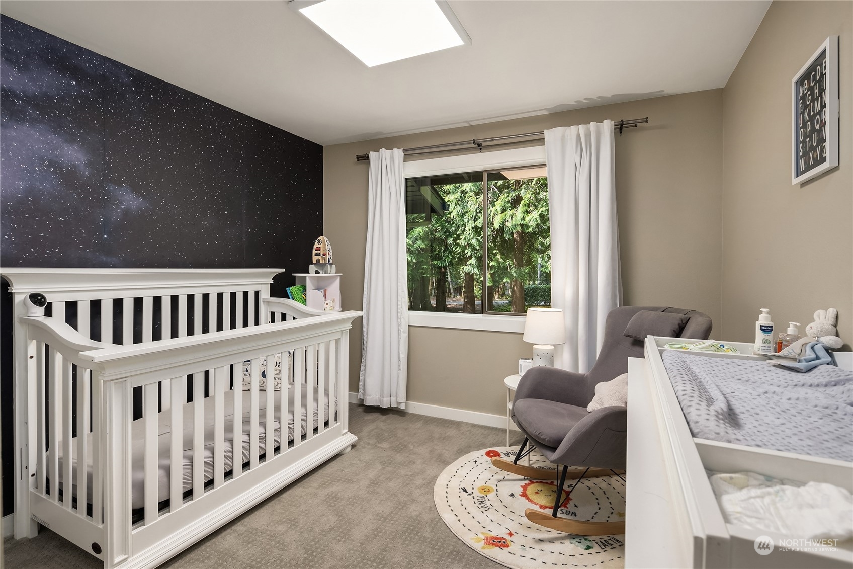 6322 Lariat Loop Bainbridge Island, WA 98110 - Photo 28 of 40 a bedroom with furniture and a window