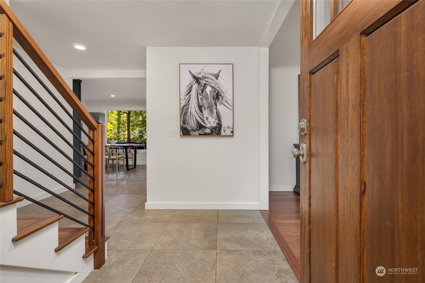 6322 Lariat Loop Bainbridge Island, WA 98110 - Photo 3 of 40 a view of a hallway with wooden floor and stairs