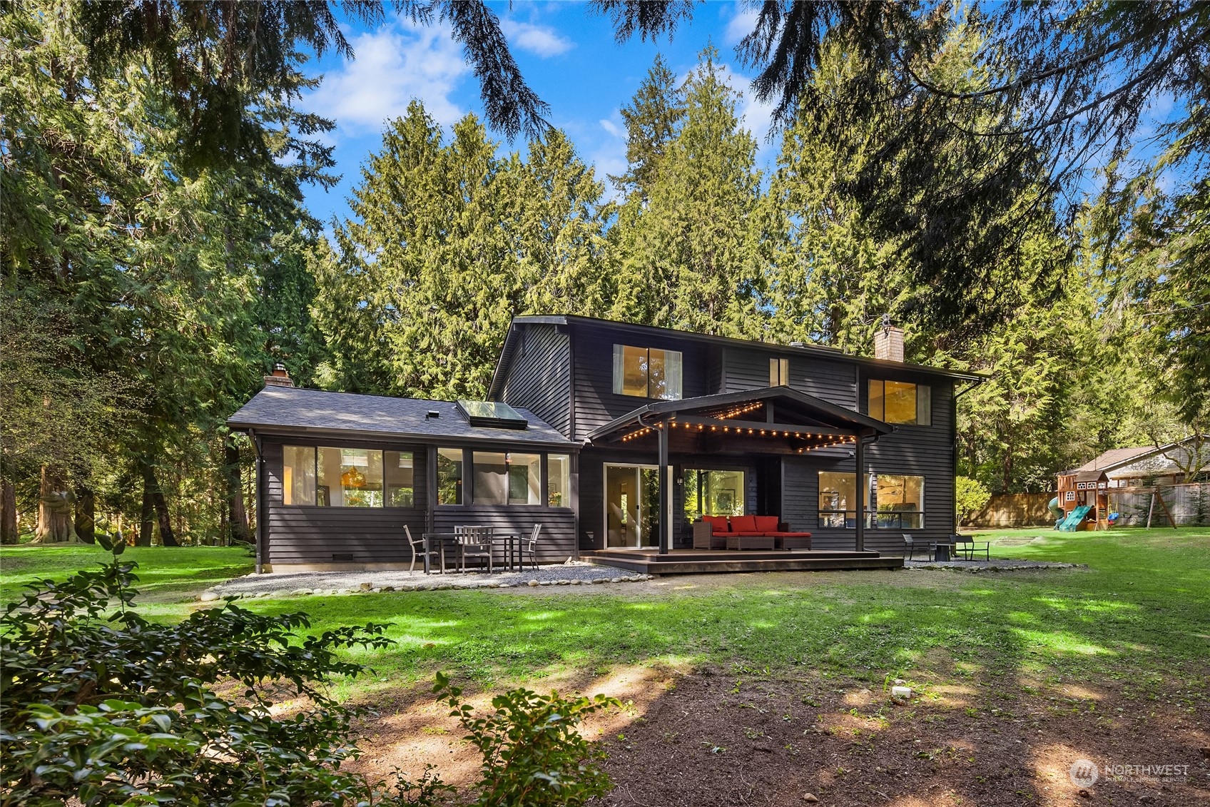 6322 Lariat Loop Bainbridge Island, WA 98110 - Photo 35 of 40 a front view of a house with garden