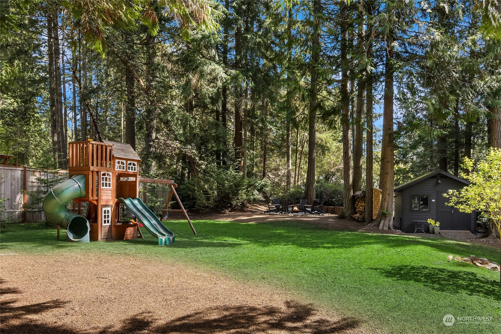 6322 Lariat Loop Bainbridge Island, WA 98110 - Photo 39 of 40 a childrens park with lots of swings and slides