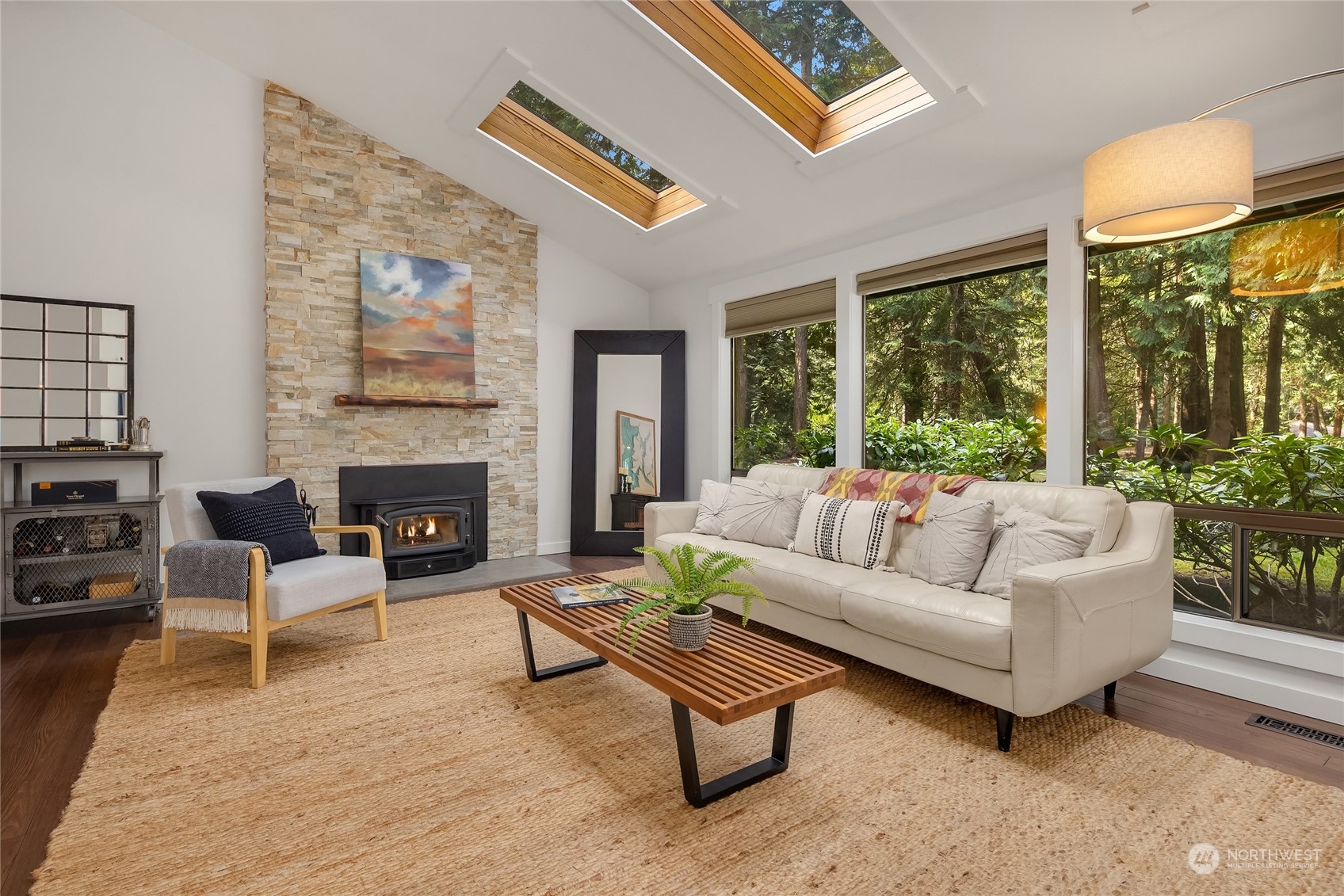 6322 Lariat Loop Bainbridge Island, WA 98110 - Photo 5 of 40 a living room with furniture a large window and a fireplace