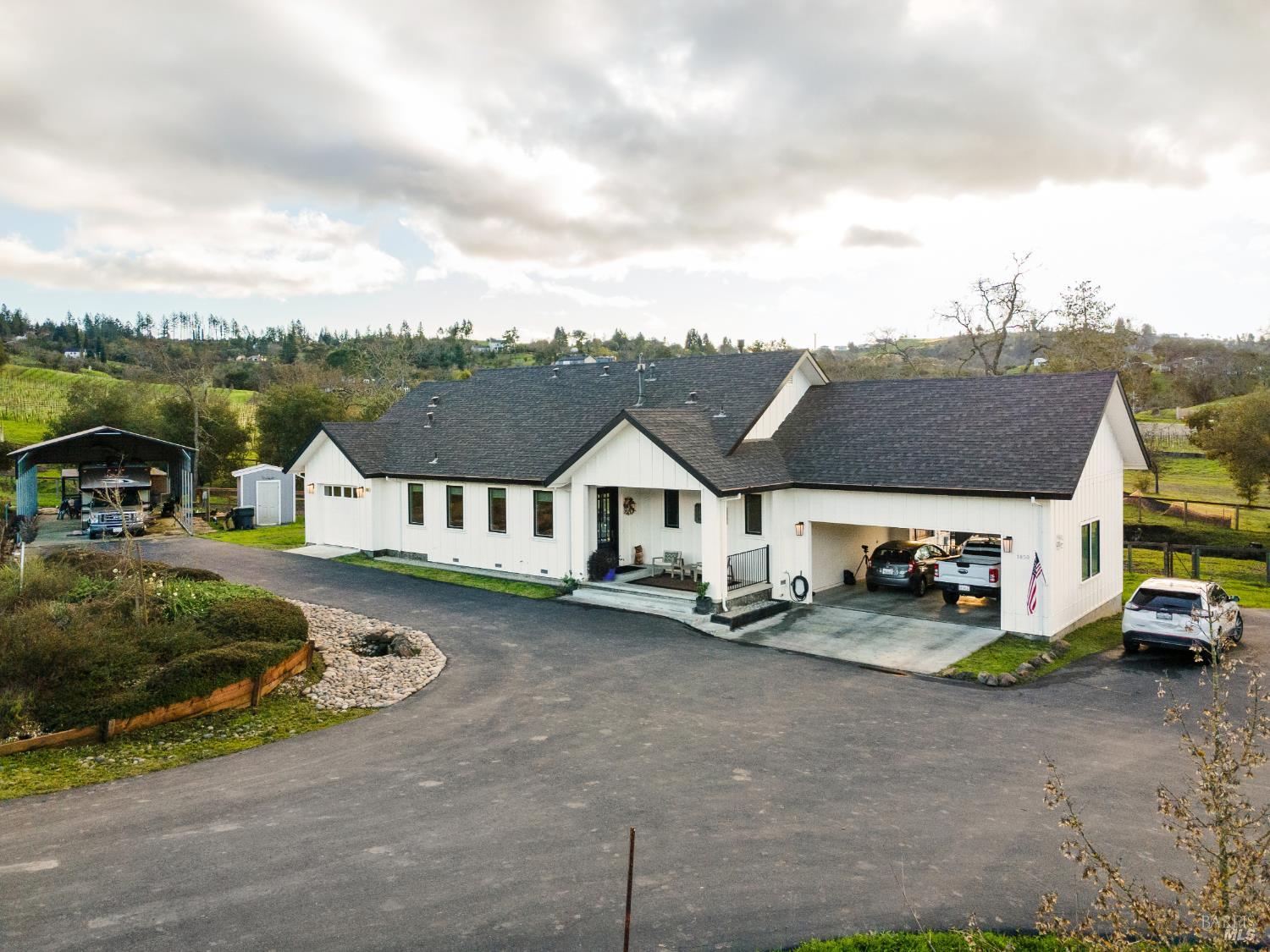 a view of a car park in front of house