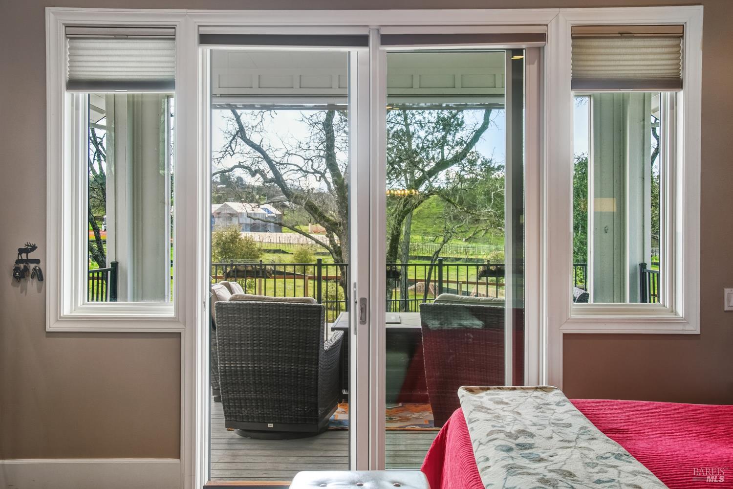1840-1850 Riebli Road Santa Rosa, CA 95404 - Photo 13 of 71 a bedroom with a bed and wooden floor
