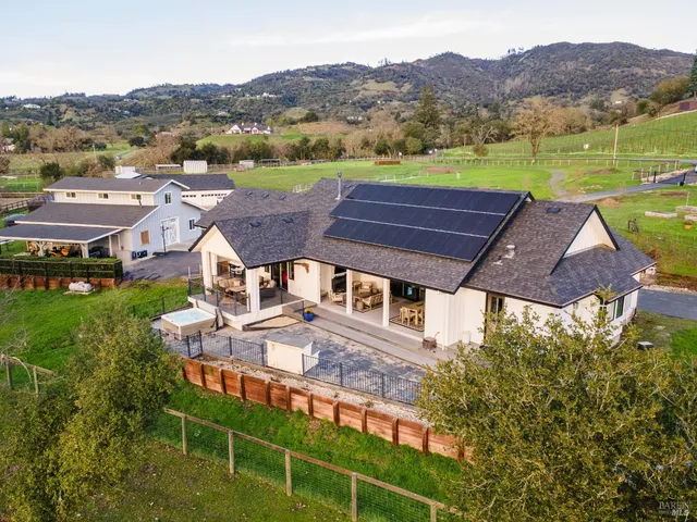 a view of a car park in front of house