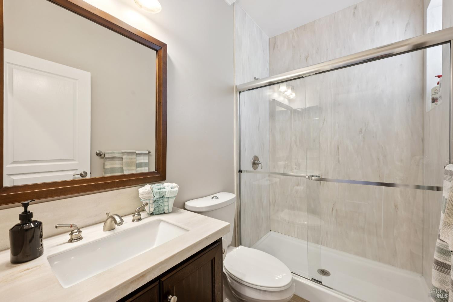 1840-1850 Riebli Road Santa Rosa, CA 95404 - Photo 40 of 71 a bathroom with a sink mirror toilet and bathtub