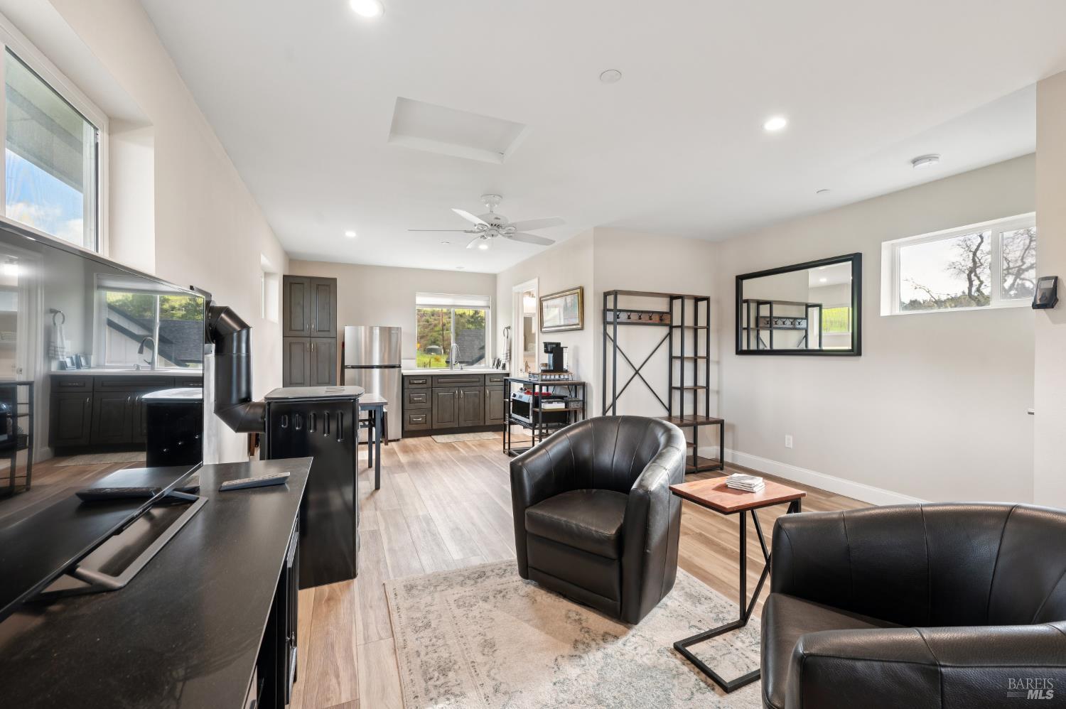 1840-1850 Riebli Road Santa Rosa, CA 95404 - Photo 51 of 71 a living room with furniture and a flat screen tv