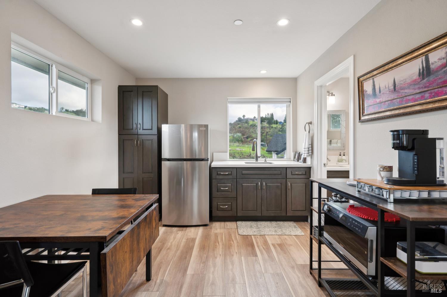 1840-1850 Riebli Road Santa Rosa, CA 95404 - Photo 52 of 71 a kitchen with a stove a refrigerator and a stove top oven