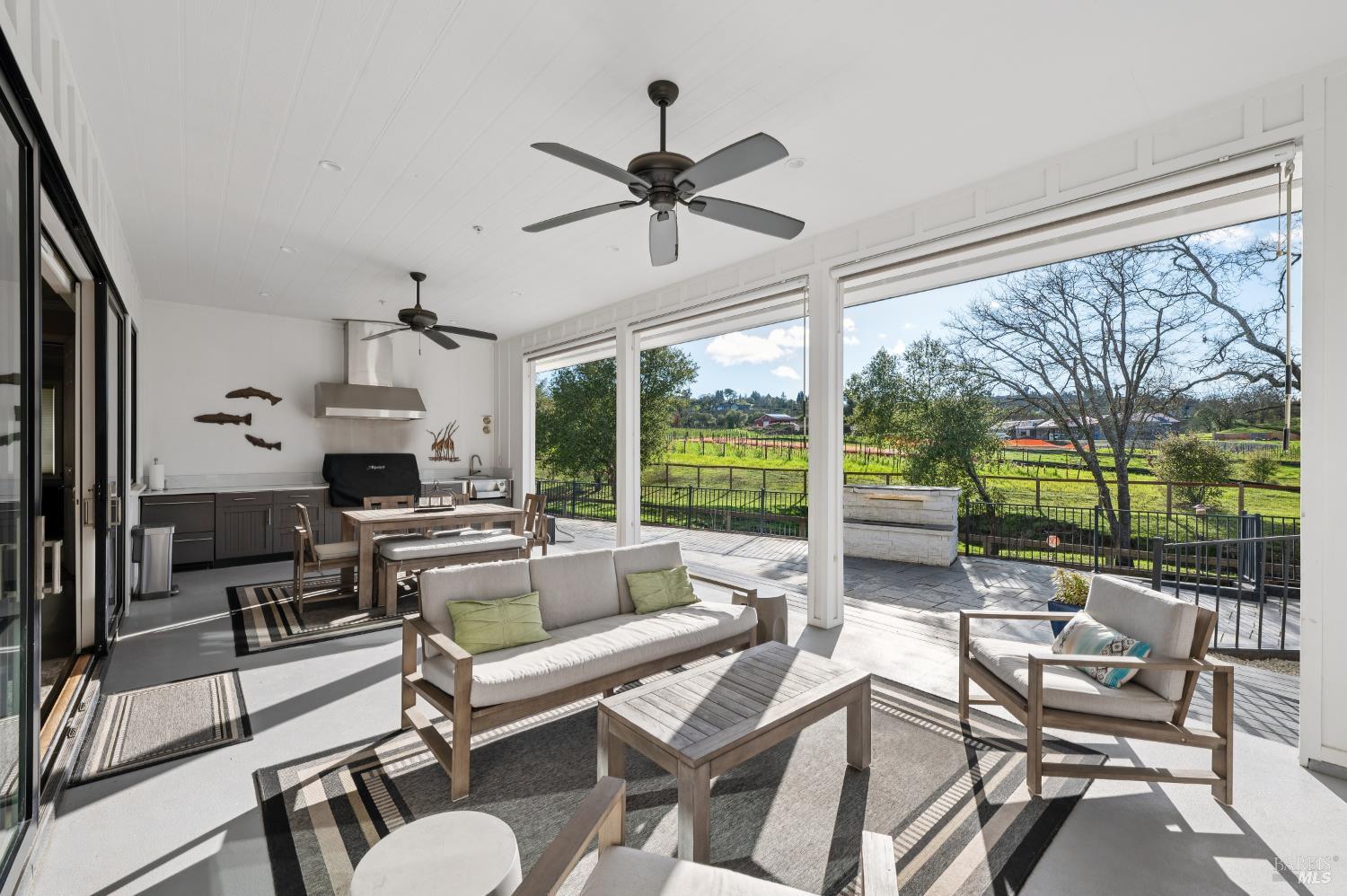 1840-1850 Riebli Road Santa Rosa, CA 95404 - Photo 6 of 71 a living room with fireplace furniture and a large window