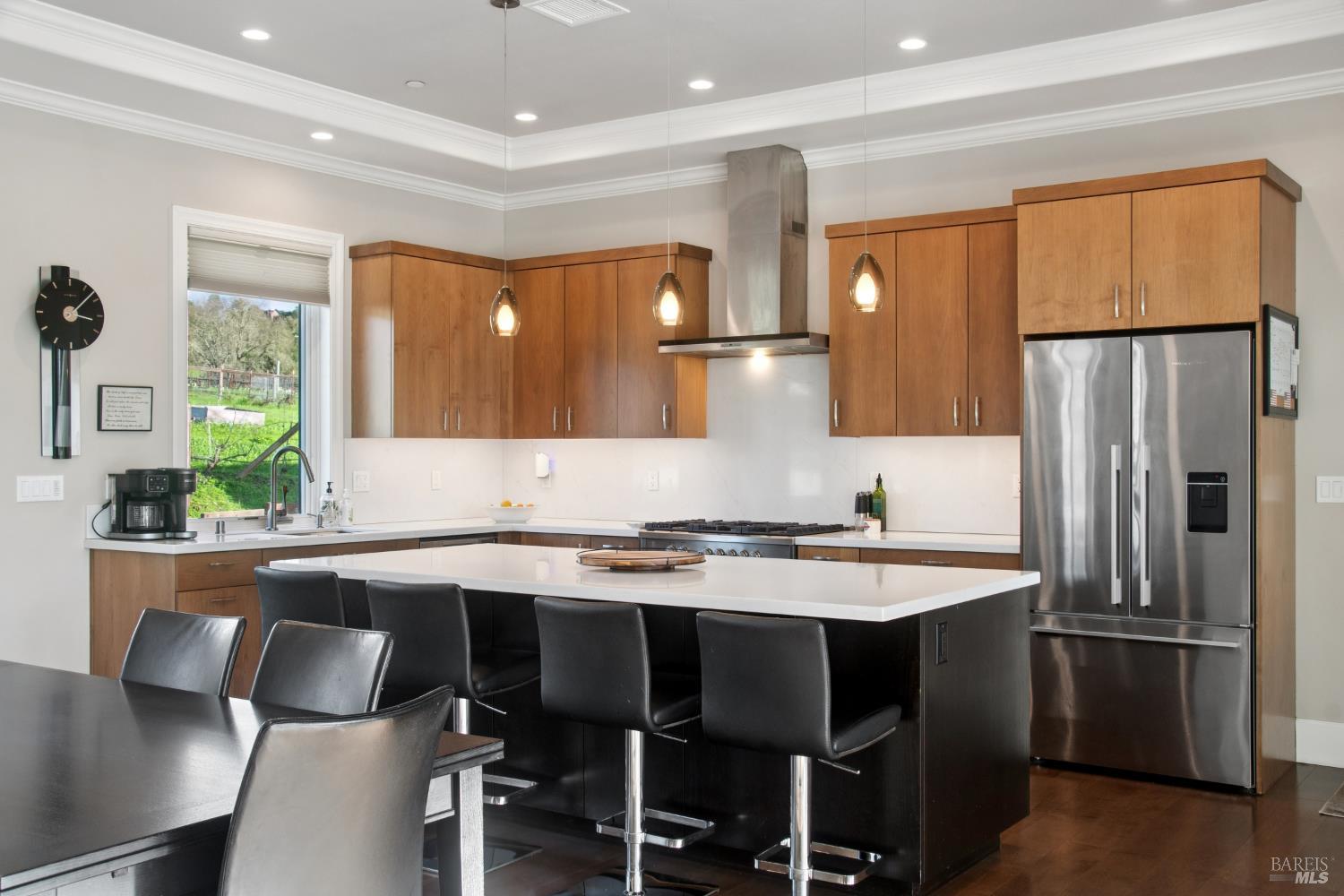 1840-1850 Riebli Road Santa Rosa, CA 95404 - Photo 9 of 70 a kitchen with granite countertop a table chairs refrigerator and microwave