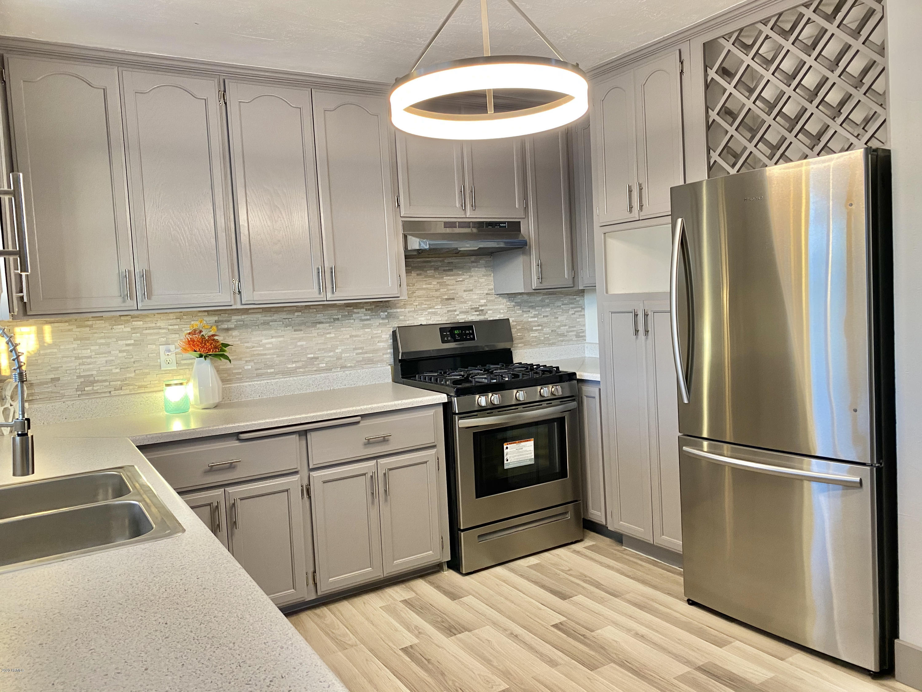 920 East Carter Road Phoenix, AZ 85042 - Photo 8 of 14 Kitchen w/ LED Chandelier