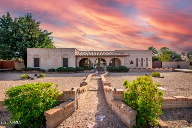 an aerial view of a house with swimming pool