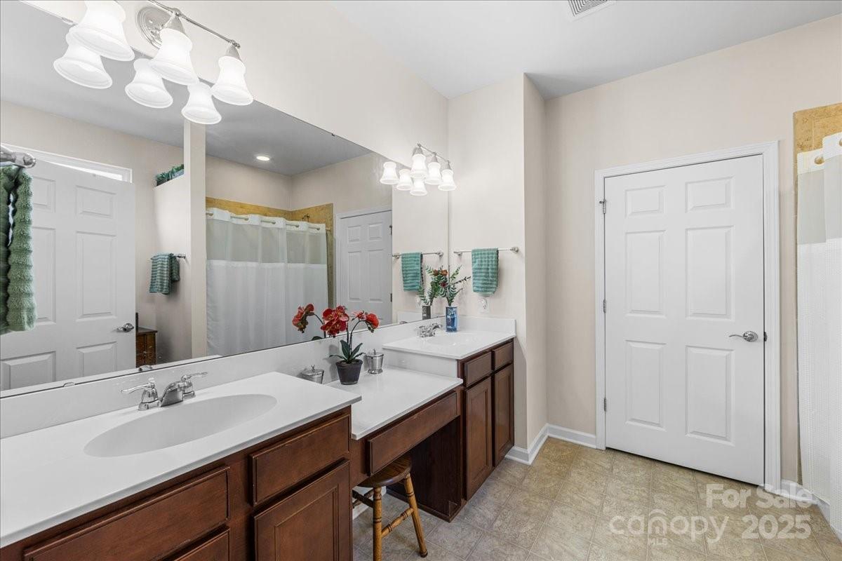 2056 Kennedy Drive Fort Mill, SC 29707 - Photo 30 of 45 a bathroom with a sink vanity and a mirror